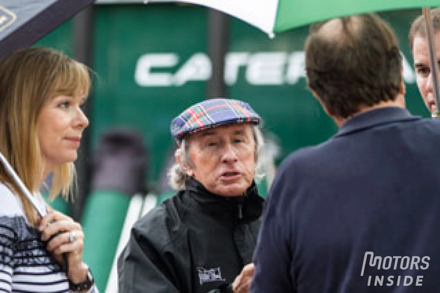 Jackie Stewart extends a hand to Romain Grosjean