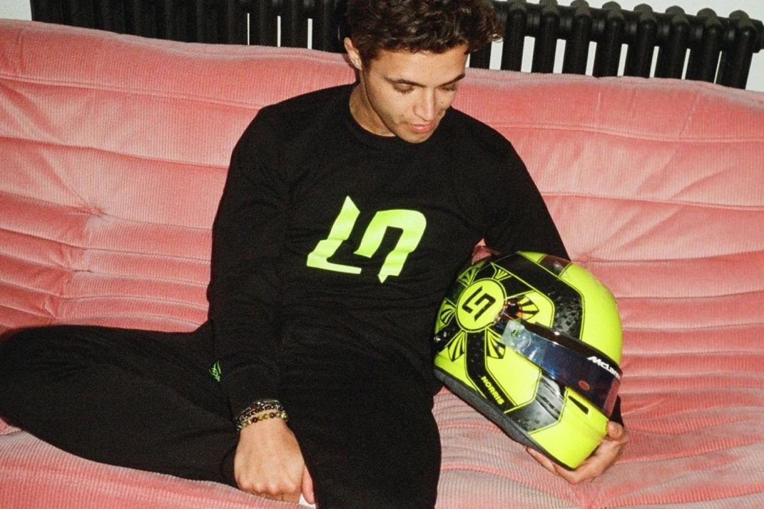 Lando Norris presents his helmet for the 2023 season