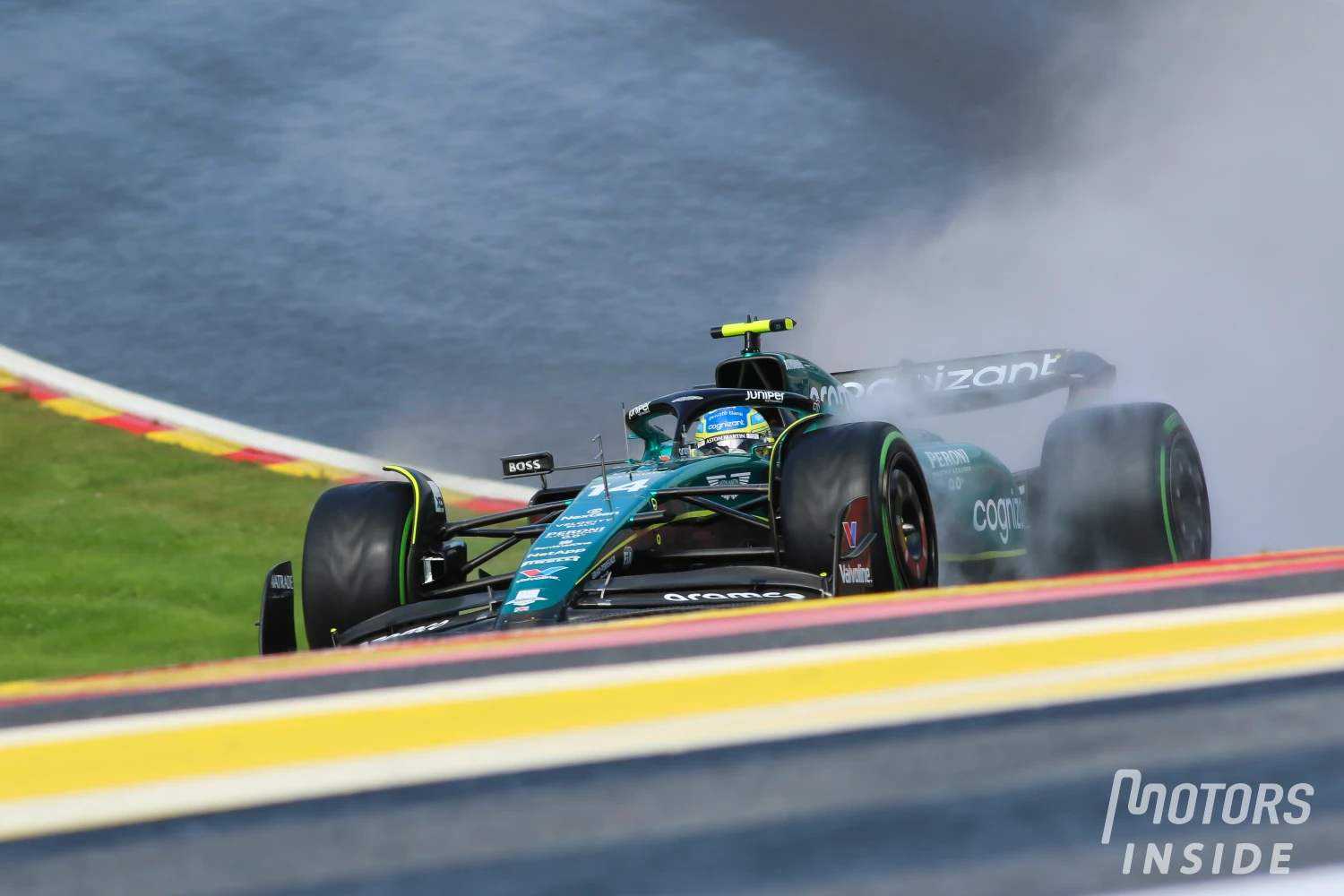 Fernando Alonso receives a warning from the race commissioners