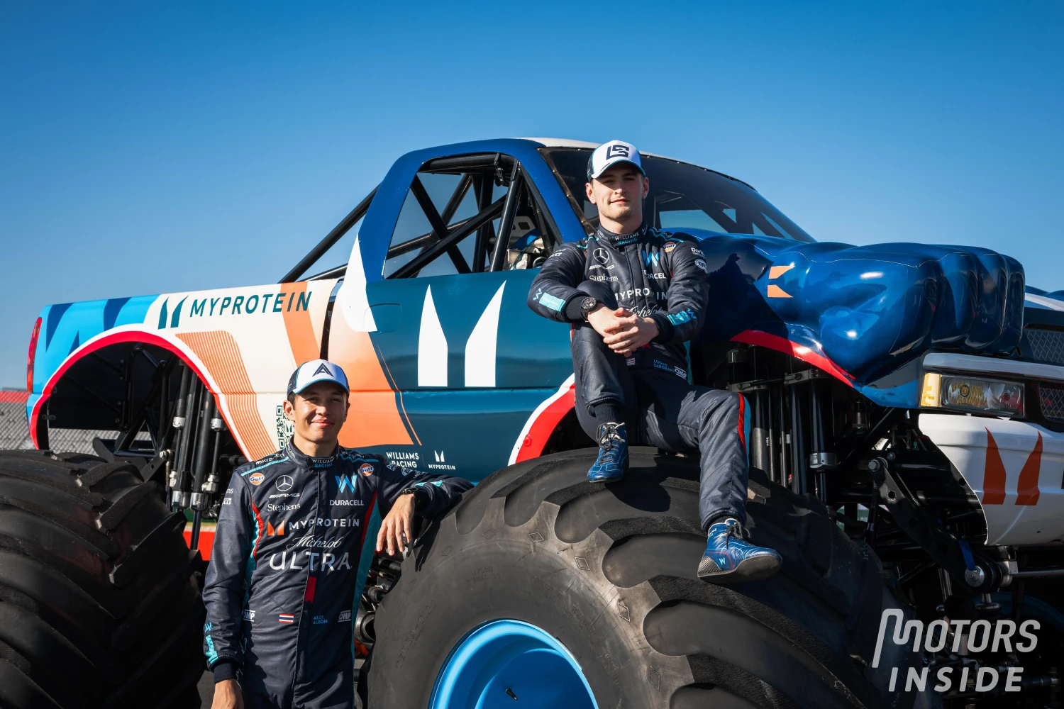 Williams announces a partnership with THG in Austin, in front of a Monster truck