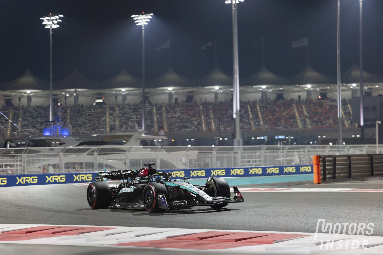 George Russell reacts to his duel with Lewis Hamilton on the last lap of the Abu Dhabi Grand Prix